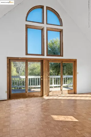 a view of a fireplace and window in a room