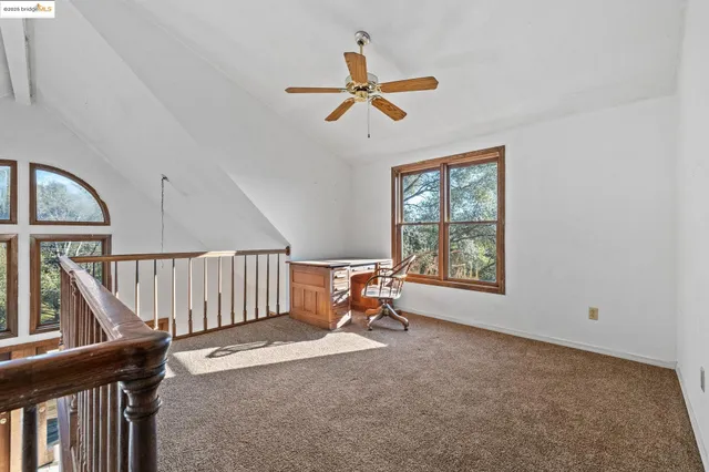 a man sitting in a room with a window