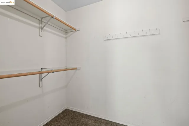 a view of balcony with wooden floor and seating space