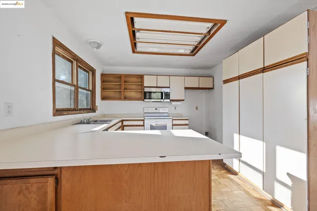 a view of a kitchen with a sink