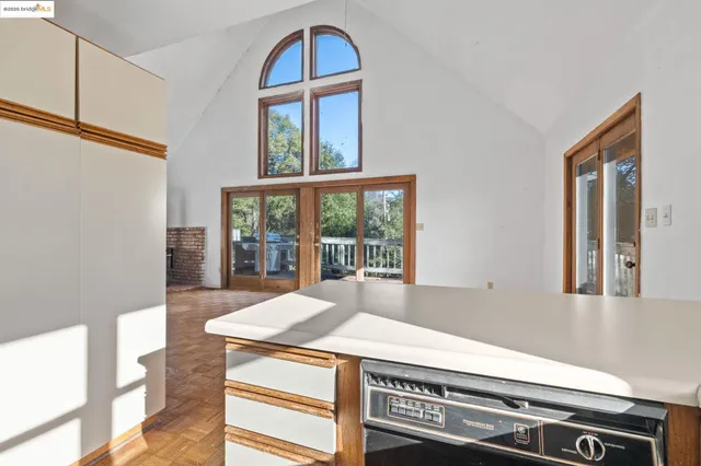 a kitchen with stainless steel appliances granite countertop a sink and a stove