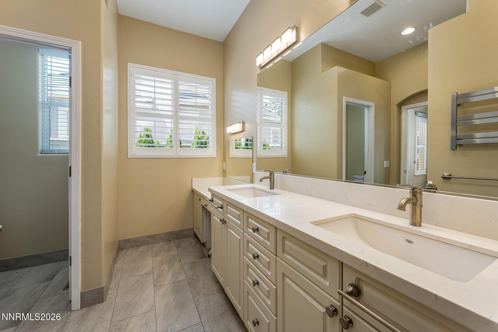 1840 Hunter Creek Road Reno, NV 89519 - Photo 16 of 39 a bathroom with a sink double vanity and a mirror