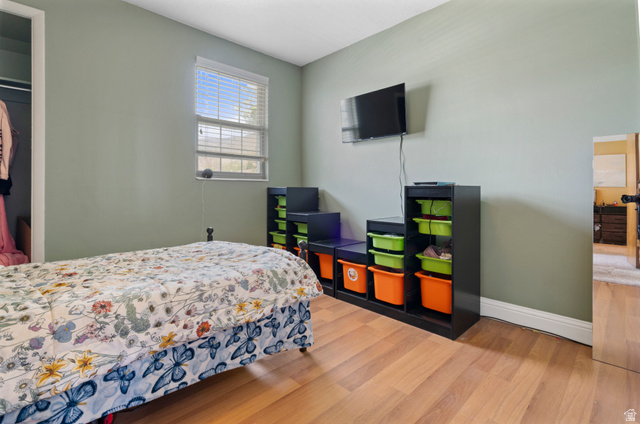 165 Pheasantbrook Drive Centerville, UT 84014 - Photo 16 of 30 Bedroom featuring light wood finished floors and baseboards