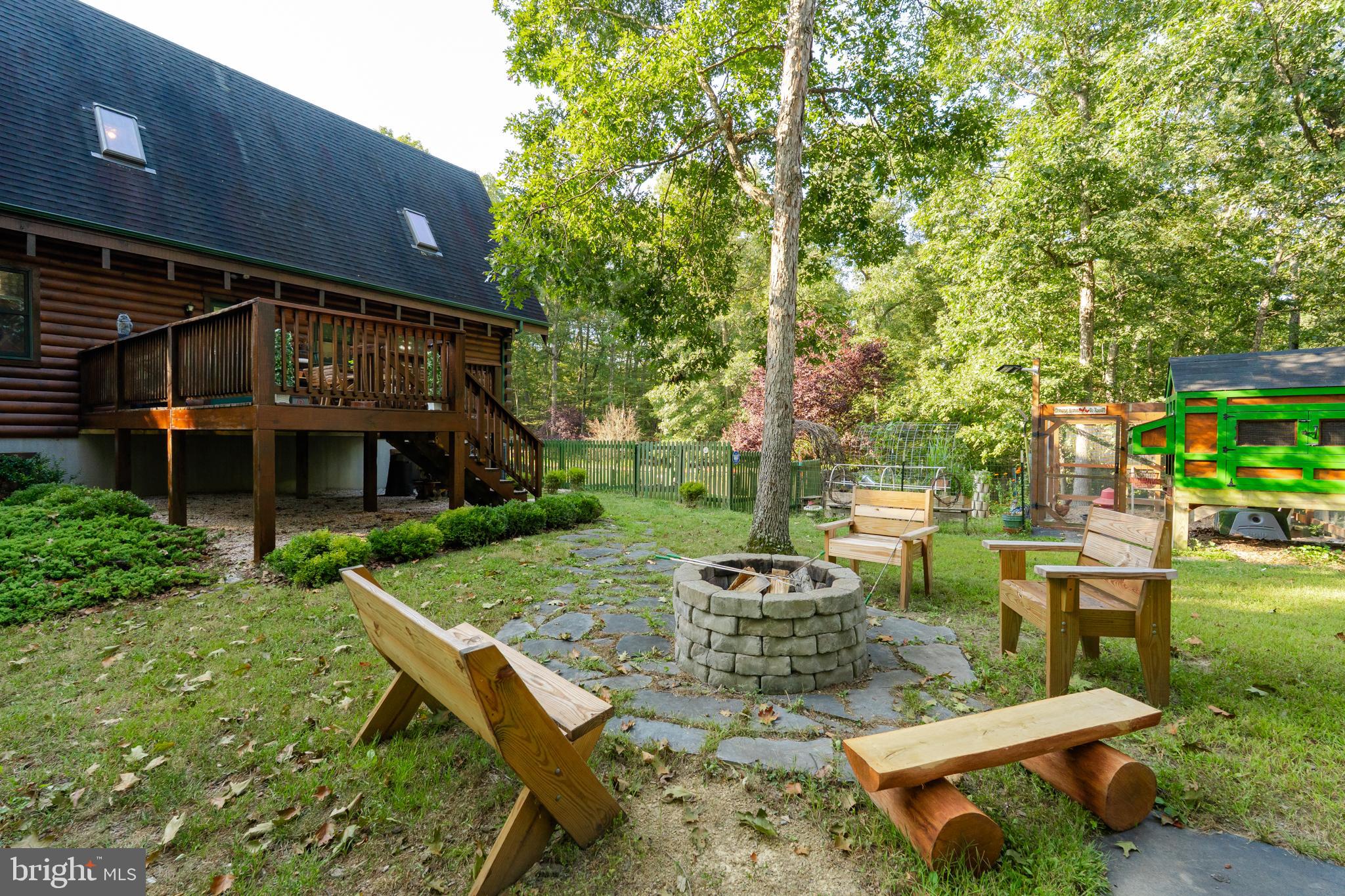 82 Sabrina Lane Gerrardstown, WV 25420 - Photo 12 of 104 a view of a chair and table in backyard of the house