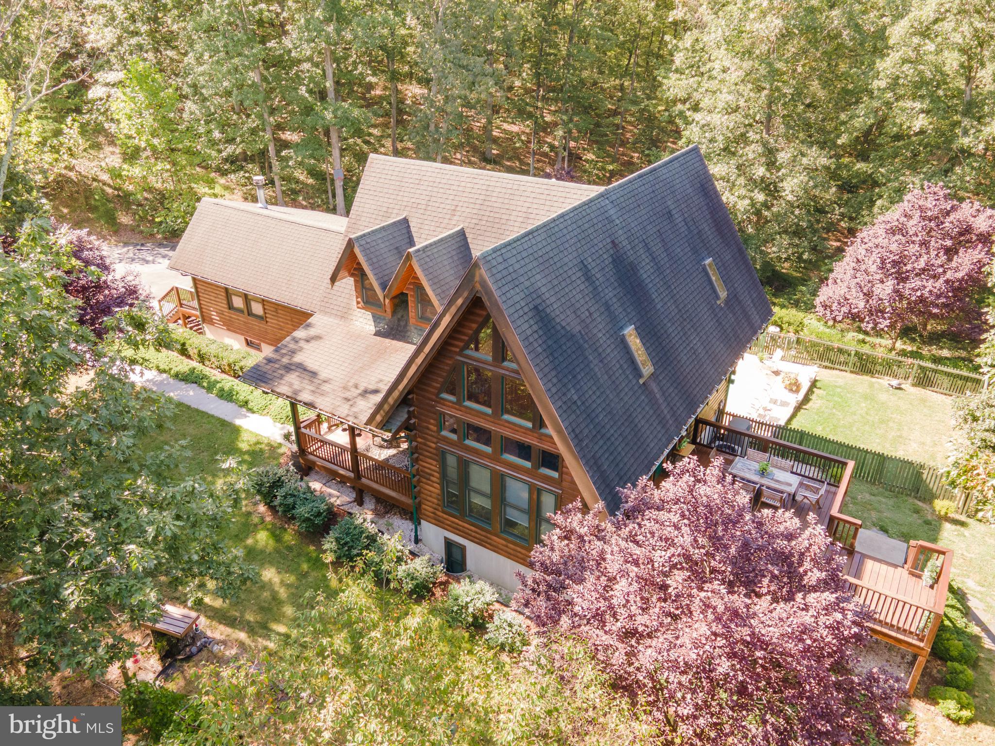 82 Sabrina Lane Gerrardstown, WV 25420 - Photo 2 of 104 an aerial view of a house with a yard and a large tree