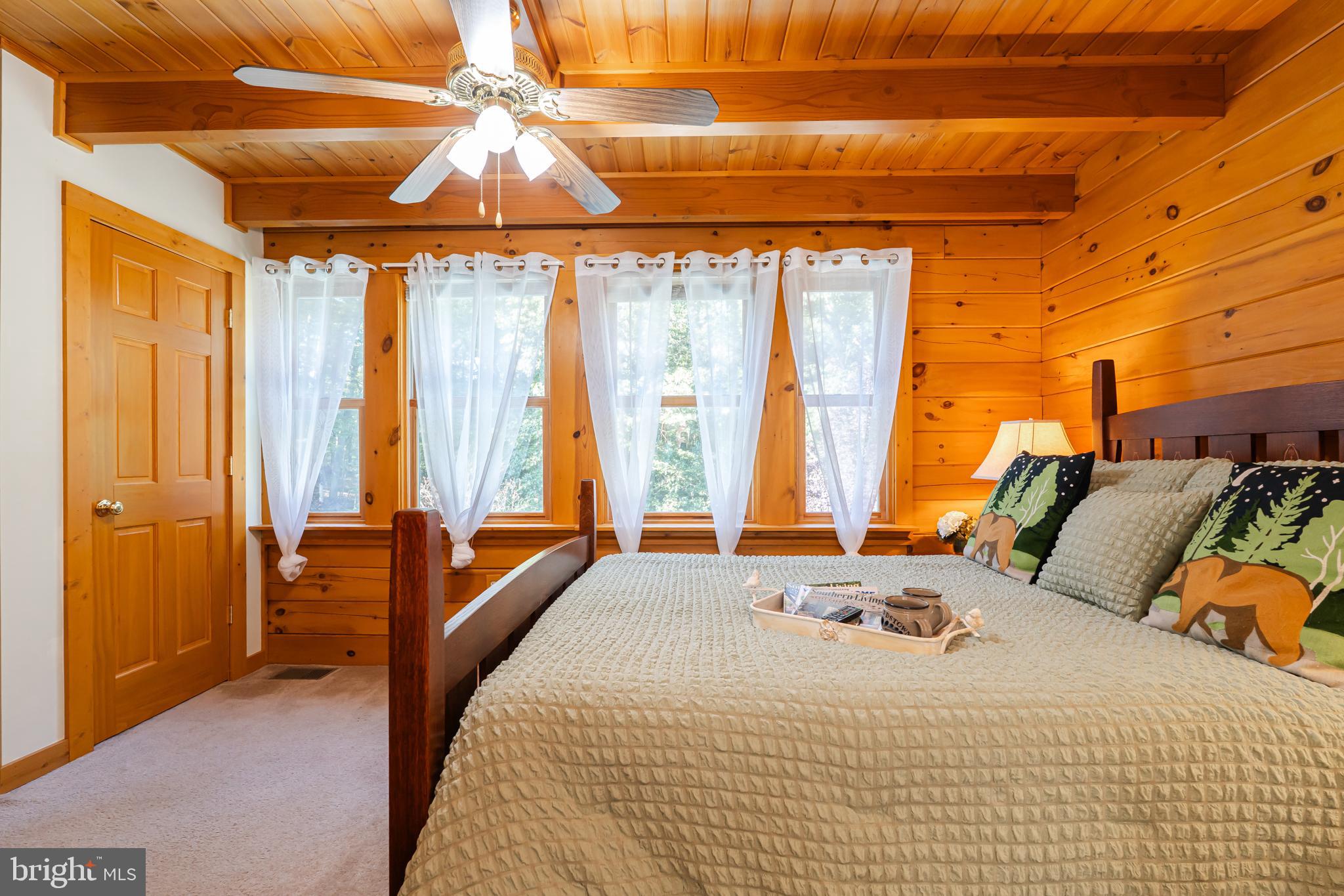 82 Sabrina Lane Gerrardstown, WV 25420 - Photo 46 of 104 a bedroom with a bed and a chandelier