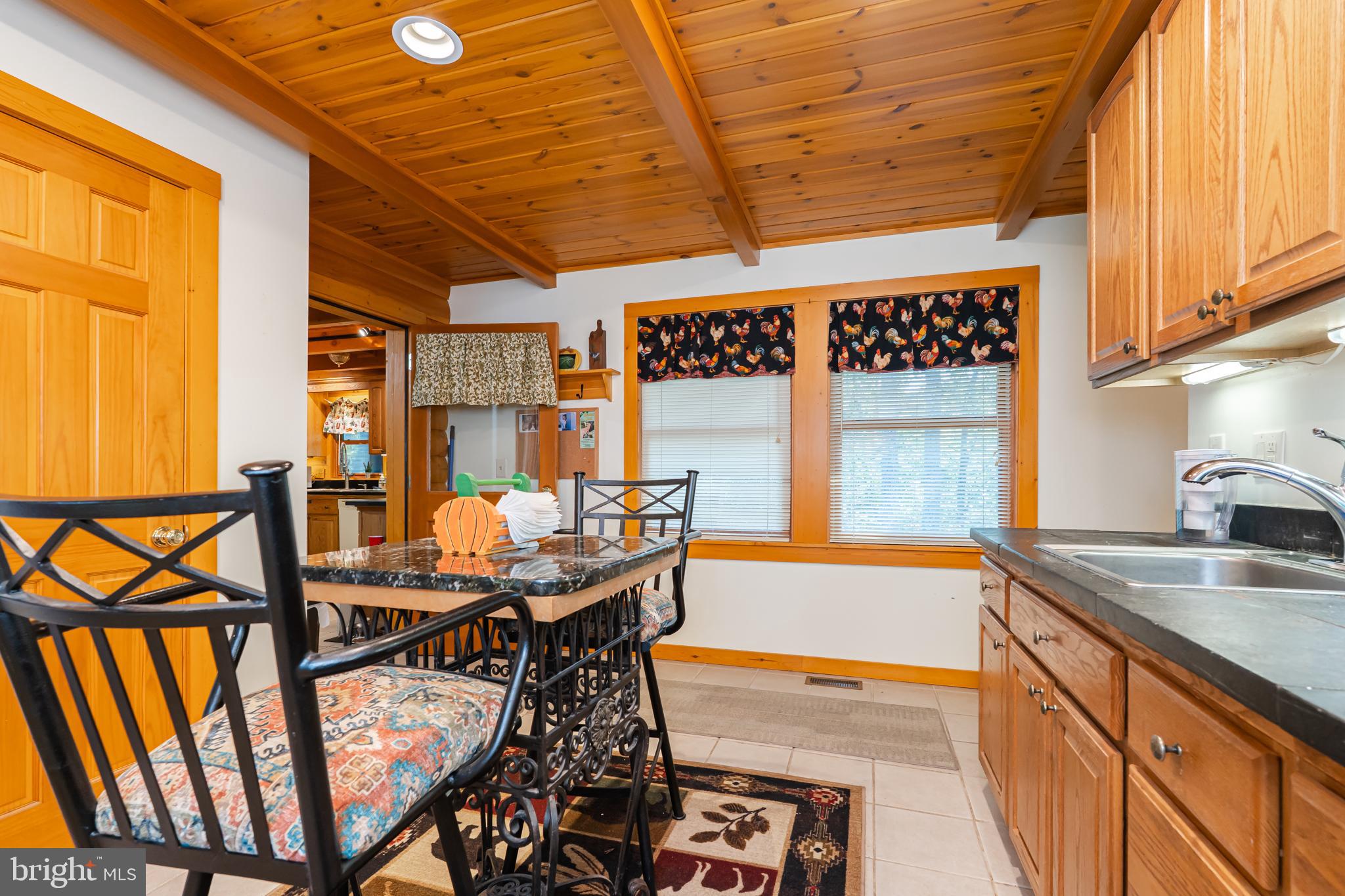 82 Sabrina Lane Gerrardstown, WV 25420 - Photo 52 of 104 a view of a dining room with furniture and window