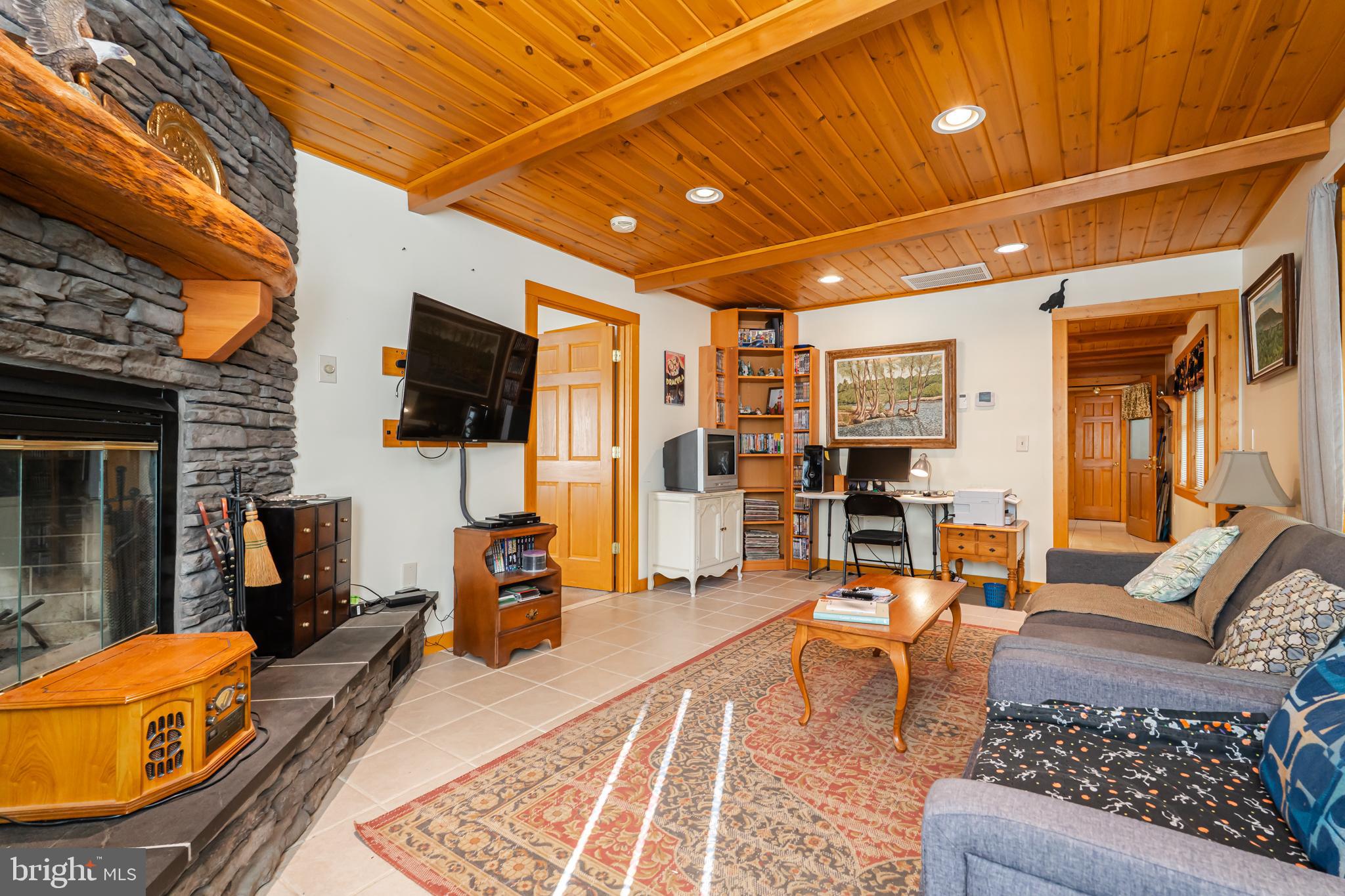 82 Sabrina Lane Gerrardstown, WV 25420 - Photo 56 of 104 a living room with furniture and a flat screen tv