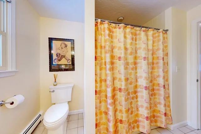 a white toilet sitting next to a bathroom sink