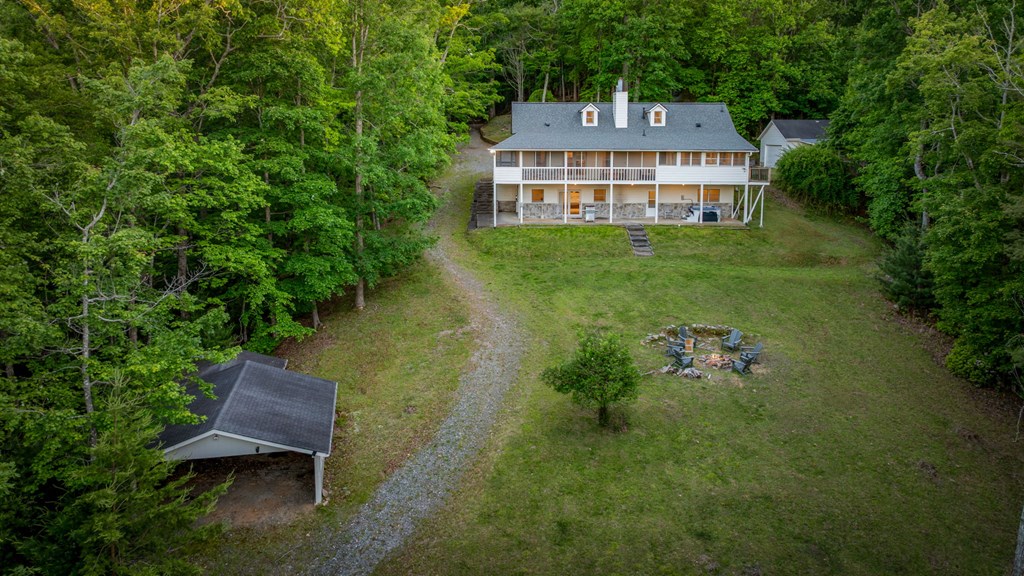 760 River Bend Lane Blue Ridge, GA 30513 - Photo 6 of 101 a view of a house with a yard and sitting area