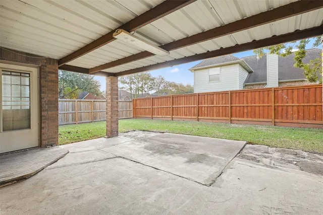 a view of backyard with green space