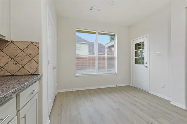 an empty room with windows