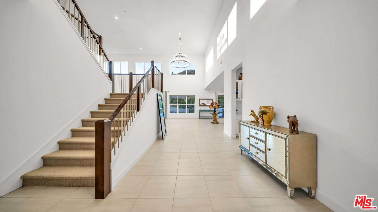 12553 Ridgeline Road Porter Ranch, CA 91326 - Photo 15 of 45 a stairs and an empty room with stairs