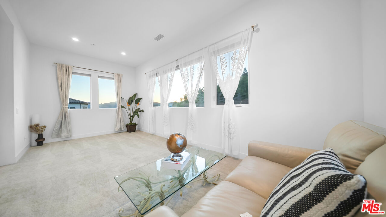 12553 Ridgeline Road Porter Ranch, CA 91326 - Photo 25 of 45 a living room with furniture and a large window