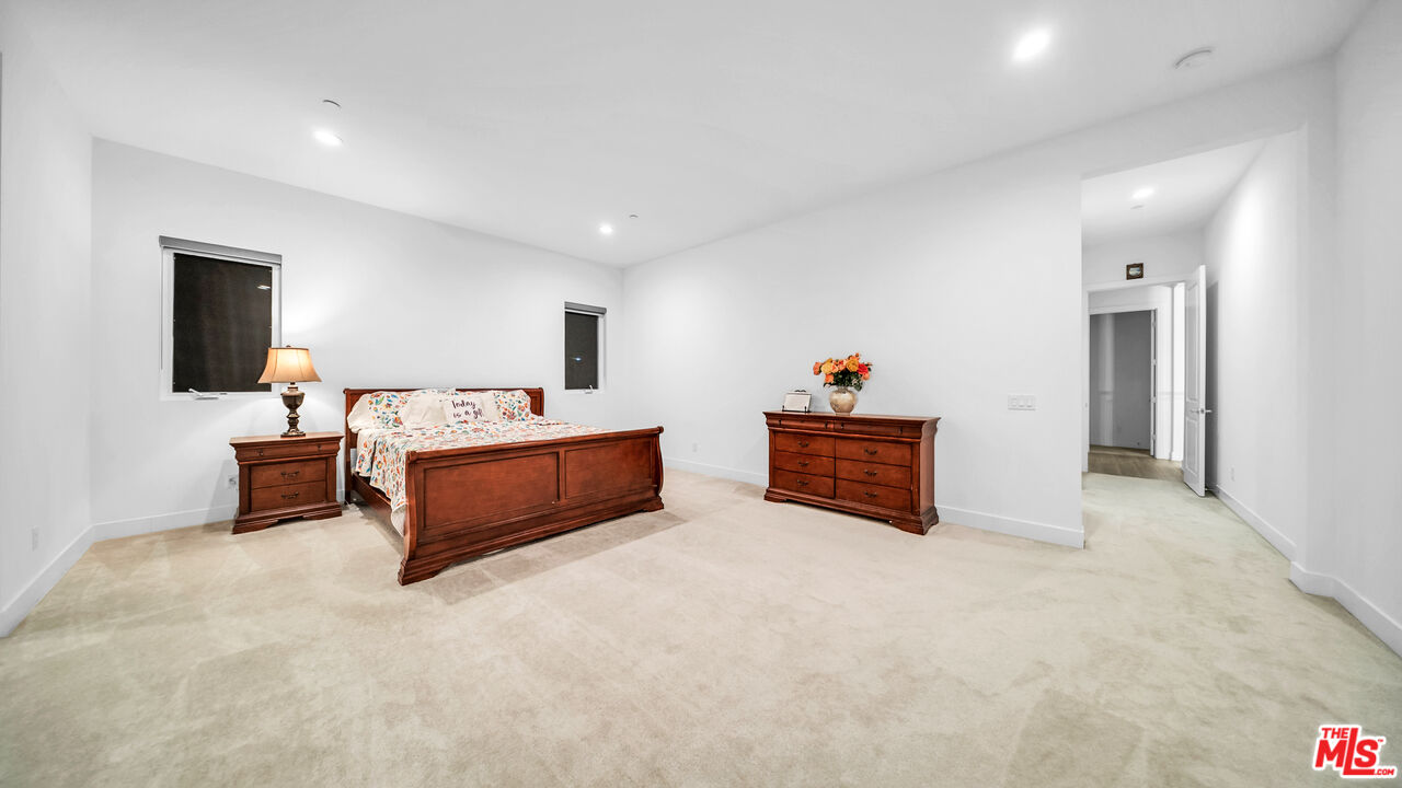 12553 Ridgeline Road Porter Ranch, CA 91326 - Photo 28 of 45 a living room with furniture and a flat screen tv