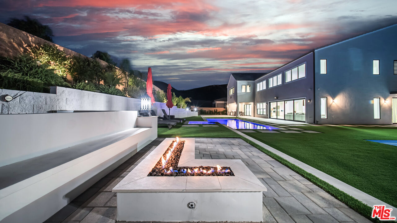 12553 Ridgeline Road Porter Ranch, CA 91326 - Photo 34 of 45 a front view of house with yard