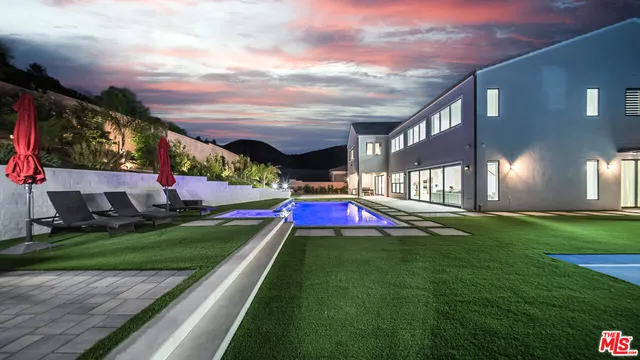 a view of a building with a yard