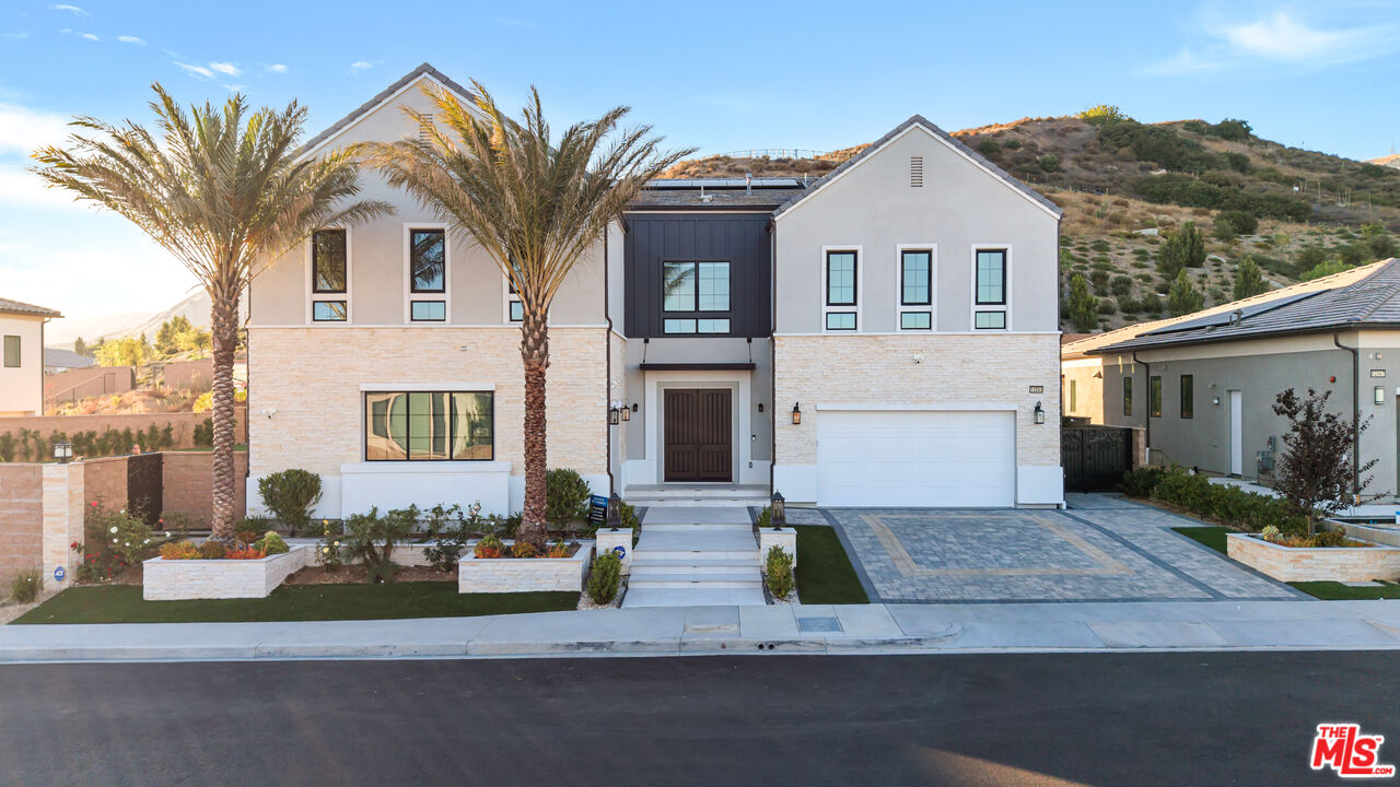 12553 Ridgeline Road Porter Ranch, CA 91326 - Photo 40 of 45 a front view of house with yard