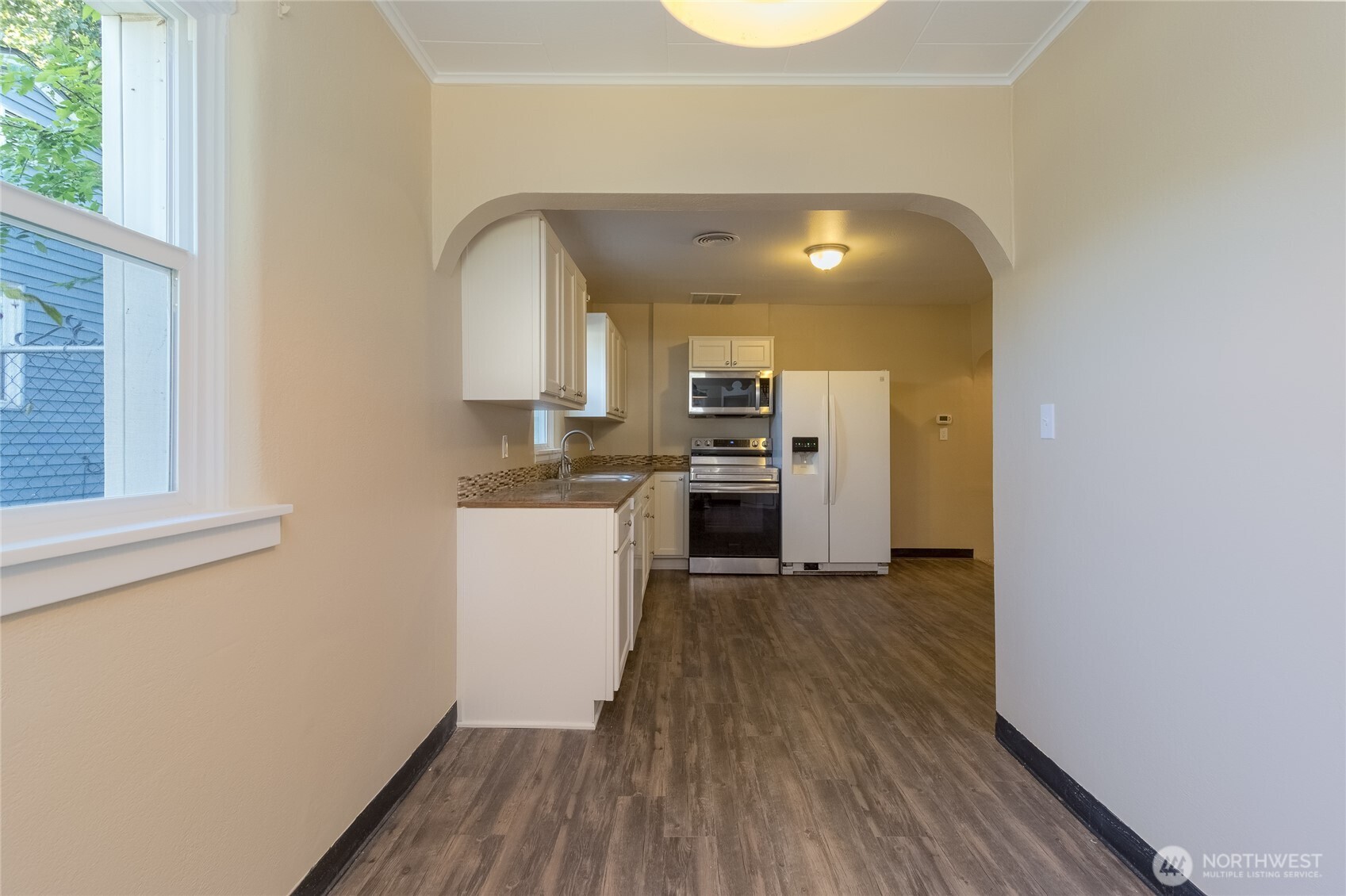 627 Juniper Street Walla Walla, WA 99362 - Photo 12 of 29 a view of a kitchen with a sink stove cabinets and a window