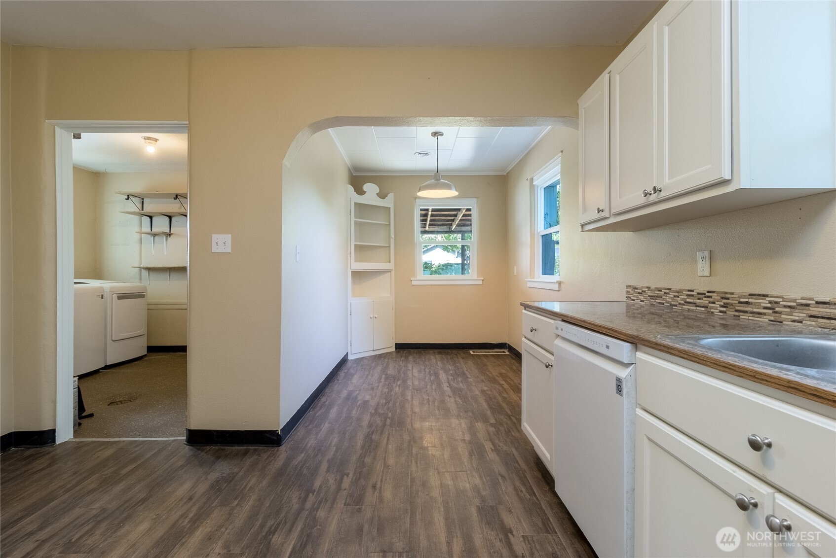 627 Juniper Street Walla Walla, WA 99362 - Photo 15 of 29 a view of a kitchen with wooden floor and a sink