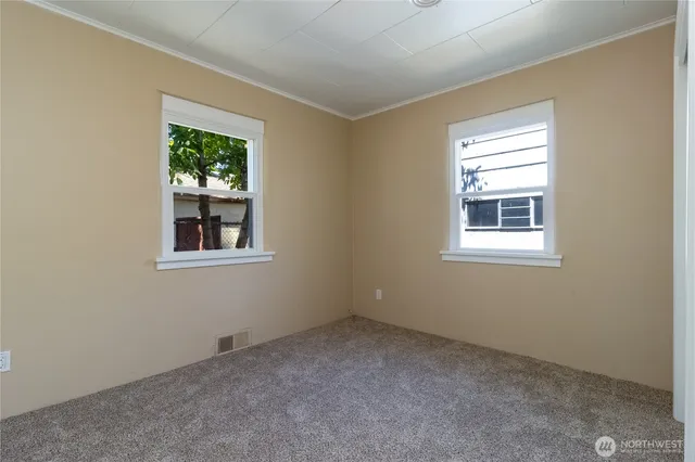 a view of an empty room with a window