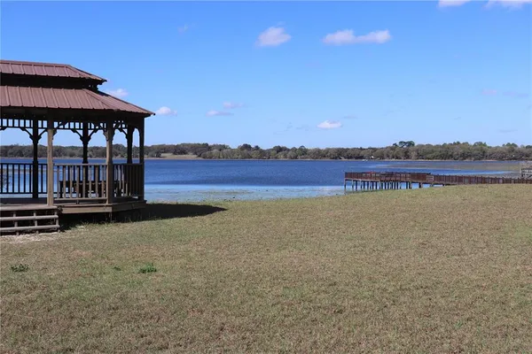a view of a terrace with a lake view
