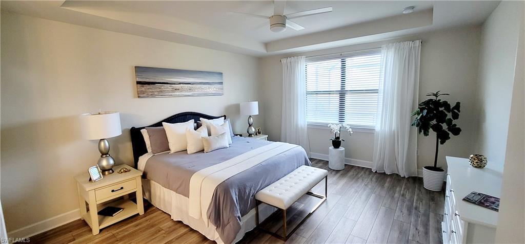 2045 Yellowfin Circle Naples, FL 34114 - Photo 11 of 23 a bedroom with a bed and a window