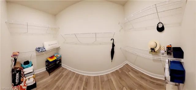 a bedroom with two beds and a window