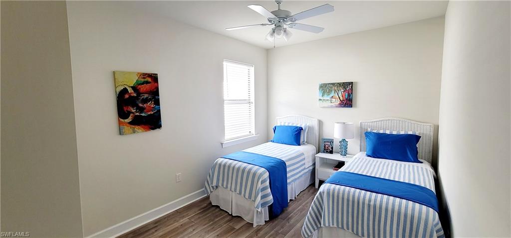 2045 Yellowfin Circle Naples, FL 34114 - Photo 16 of 23 a bedroom with two beds and a window