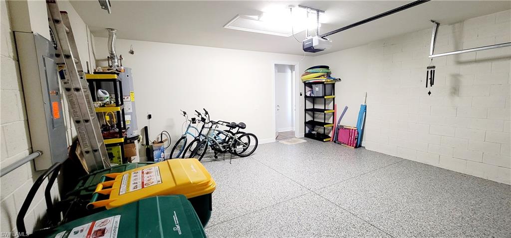 2045 Yellowfin Circle Naples, FL 34114 - Photo 21 of 23 a view of walk in closet with clothes