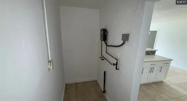 a bathroom with a granite countertop toilet a sink and bathtub