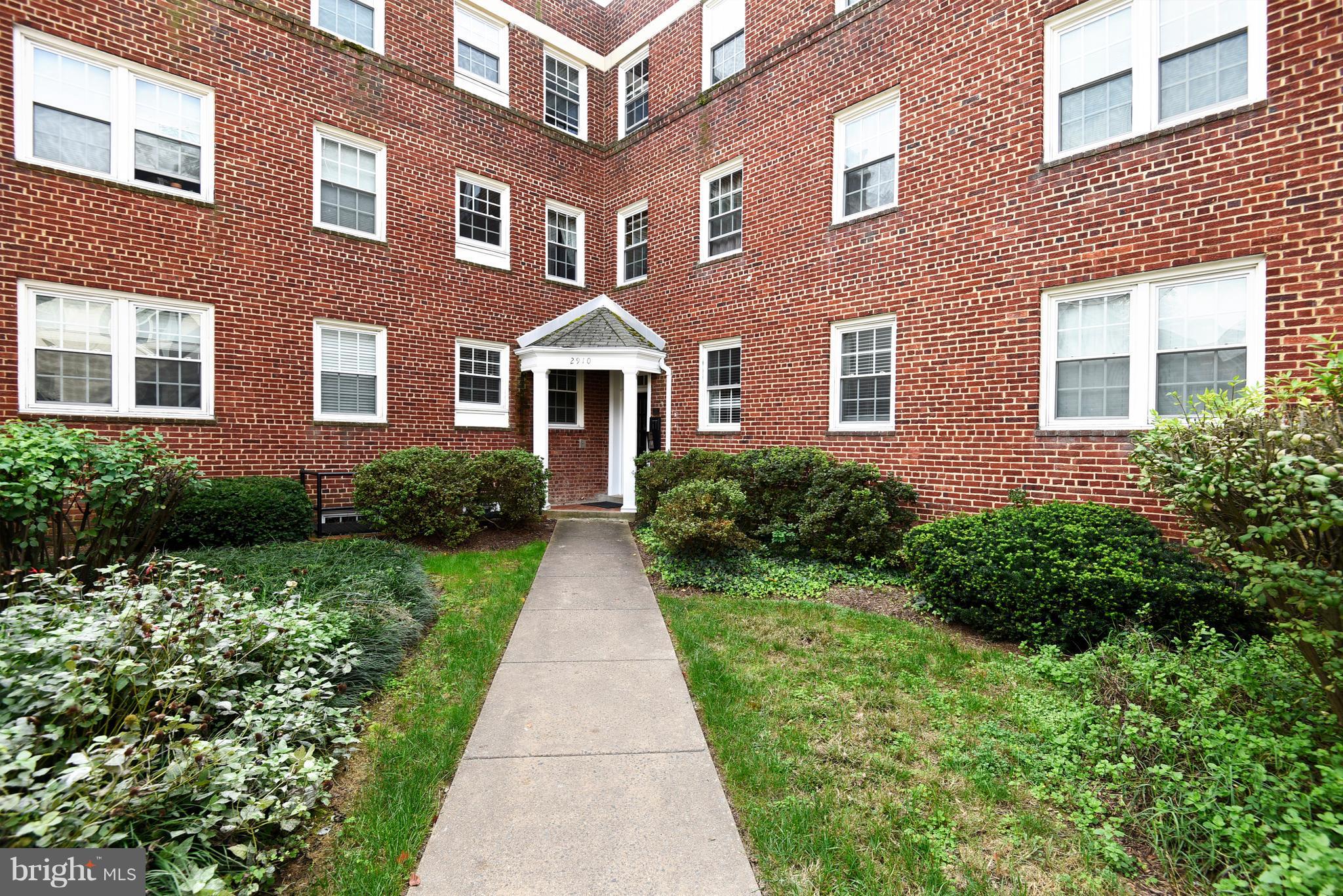 2910 13th Road South, Unit 101 Arlington, VA 22204 - Photo 1 of 1 a front view of a house with garden
