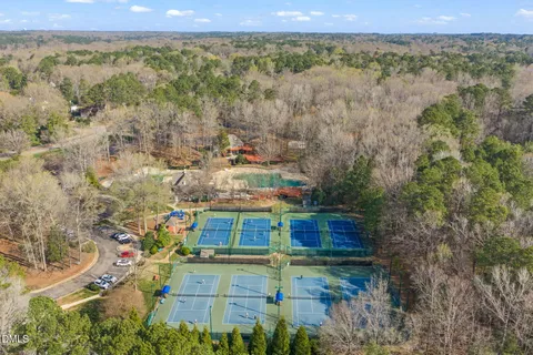 a view of a swimming pool with a yard