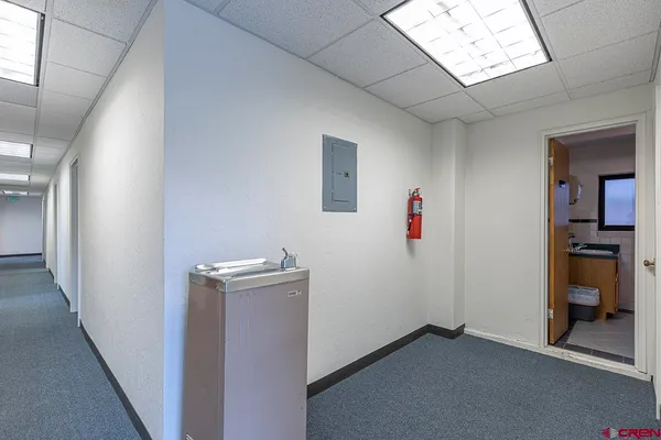 a view of a hallway with workspace