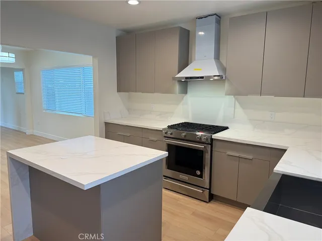 a kitchen with a stove and a sink