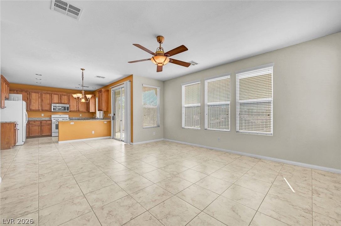 977 Sparkling Light Street Henderson, NV 89052 - Photo 24 of 75 Bright and open-concept living area with a functional kitchen.