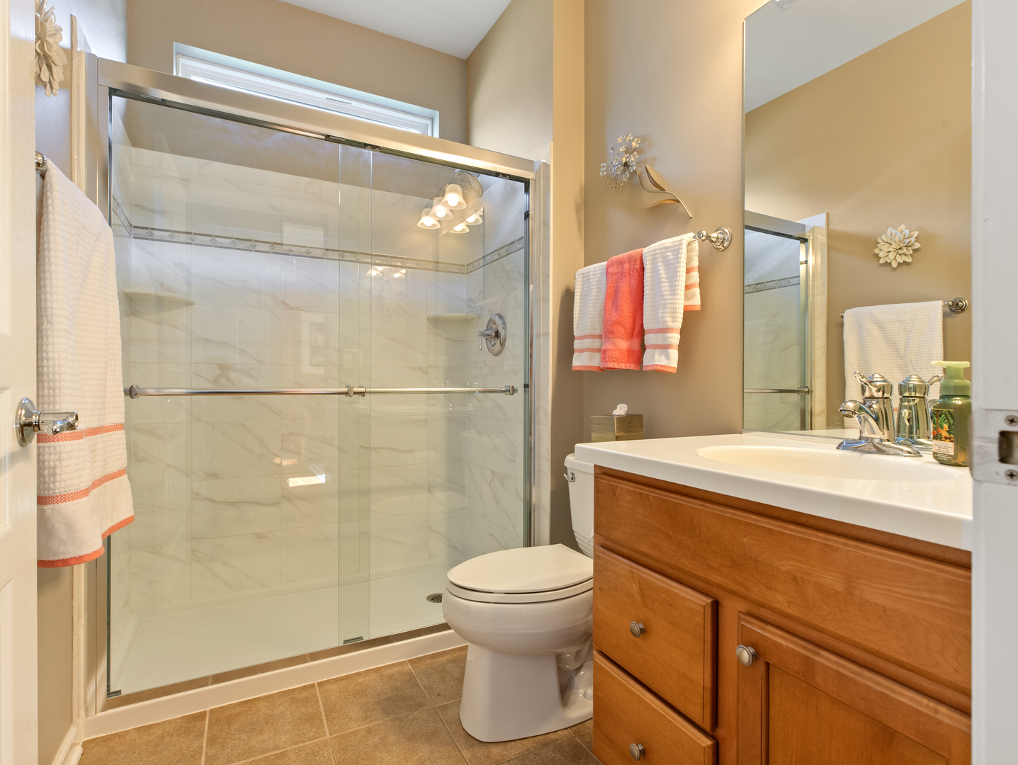 3001 Ravinia Circle Mundelein, IL 60060 - Photo 22 of 35 a bathroom with a sink toilet a mirror and shower