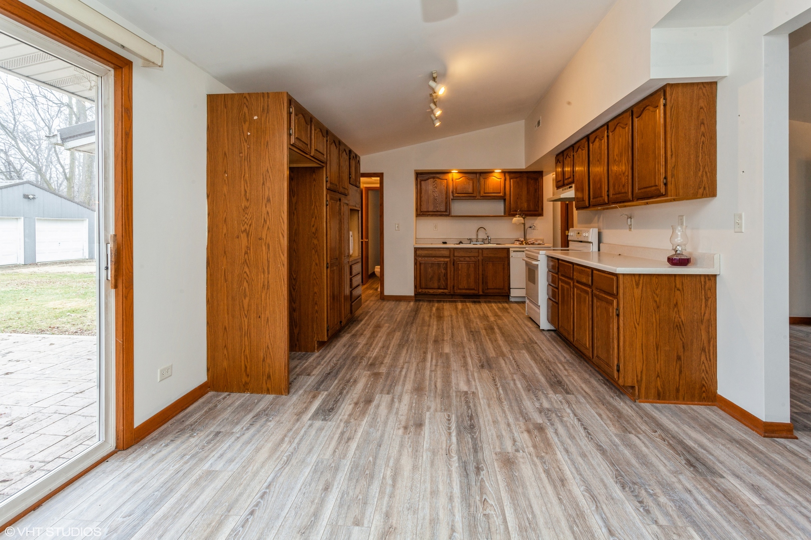 35013 Glidden Road Kingston, IL 60145 - Photo 8 of 23 a kitchen with stainless steel appliances a refrigerator and wooden floor