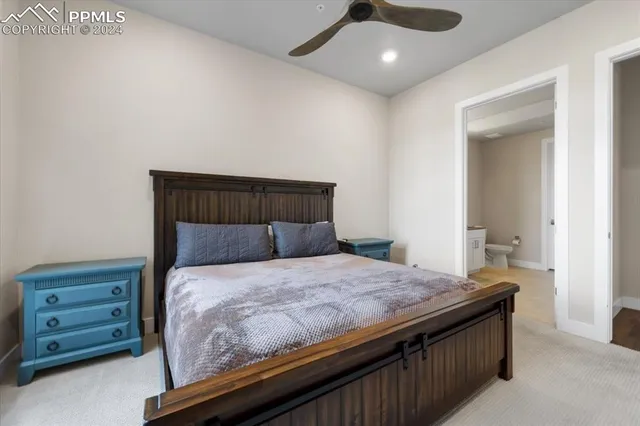 a bedroom with a bed and a couch