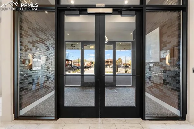 a living room with fireplace furniture and a chandelier