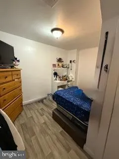 a bedroom with a bed and flat screen tv