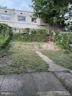 a backyard of a house with lots of green space and lake view