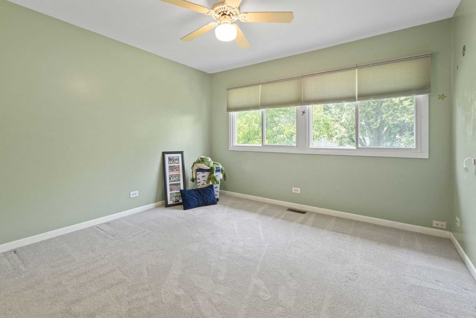 416 Swallow Lane Deerfield, IL 60015 - Photo 18 of 31 an empty room with a window and a chandelier fan