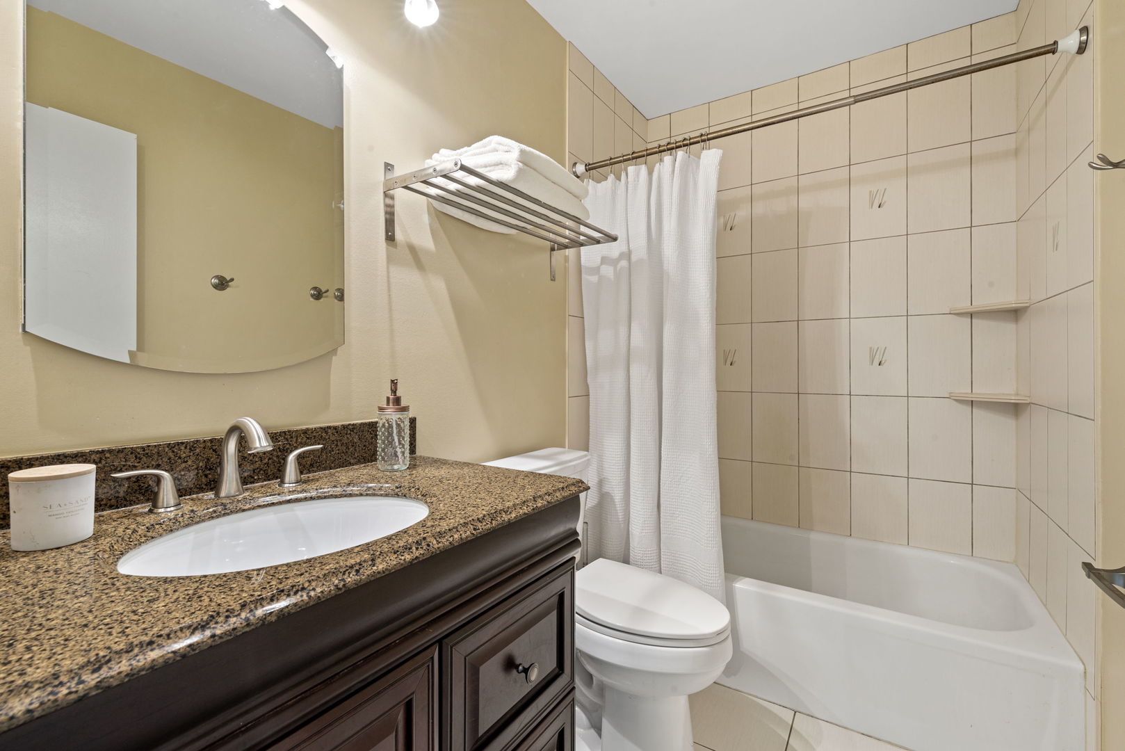 416 Swallow Lane Deerfield, IL 60015 - Photo 19 of 31 a bathroom with a granite countertop sink a toilet a mirror and shower