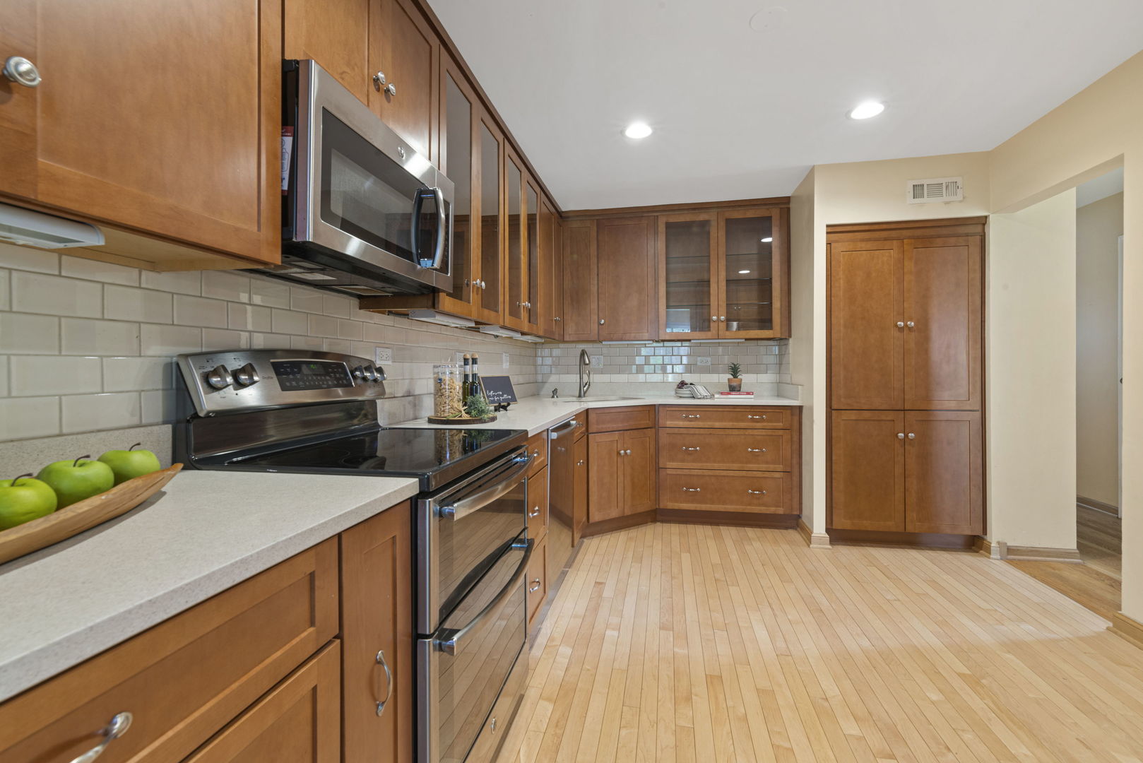416 Swallow Lane Deerfield, IL 60015 - Photo 8 of 31 a kitchen with stainless steel appliances granite countertop a refrigerator and a stove top oven
