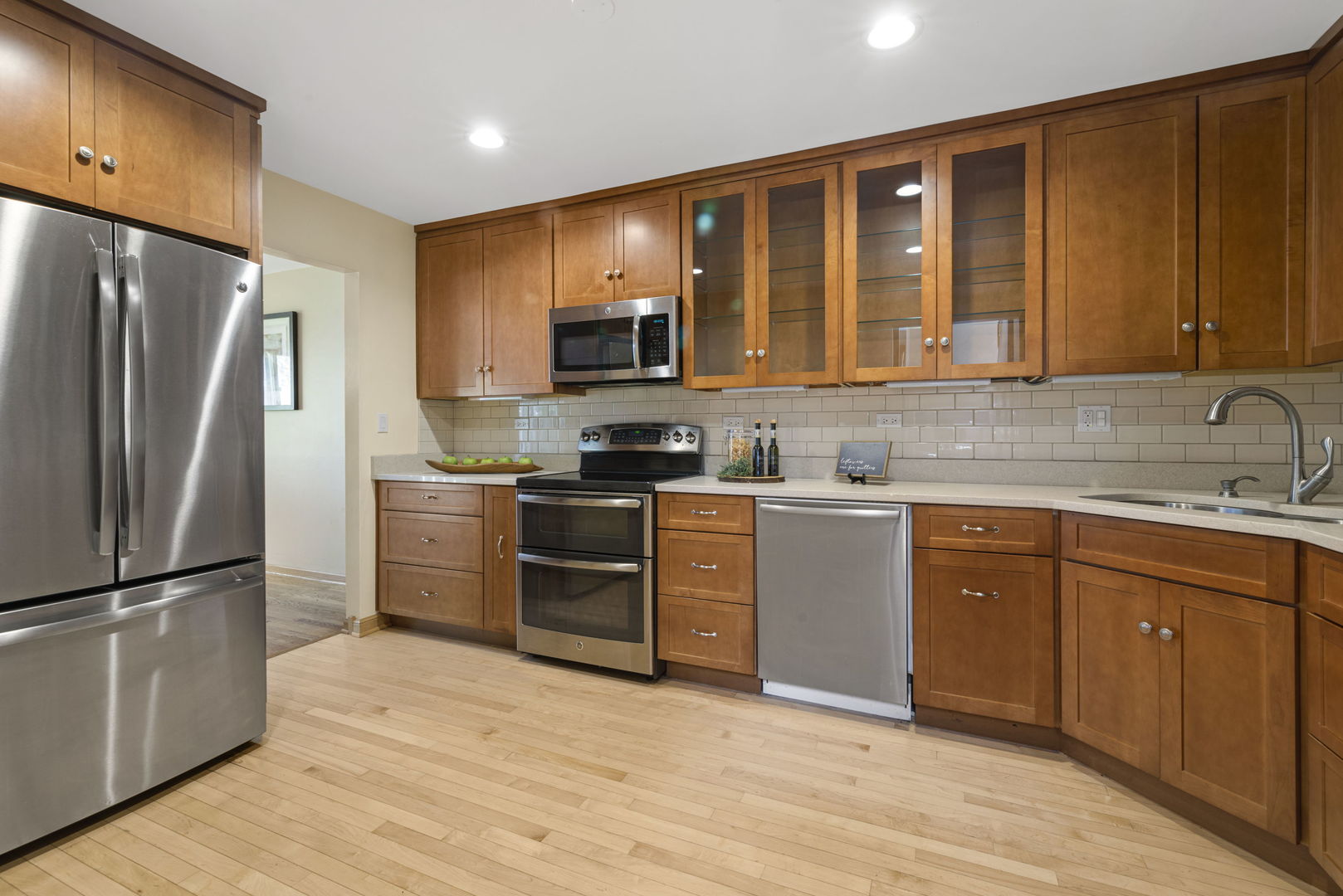 416 Swallow Lane Deerfield, IL 60015 - Photo 9 of 31 a kitchen with granite countertop a refrigerator stove and sink