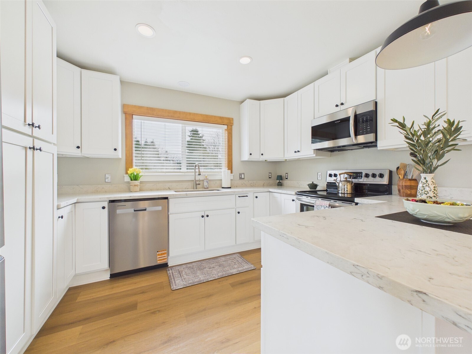 481 Kirkland Road Chehalis, WA 98532 - Photo 11 of 40 a kitchen with cabinets stainless steel appliances a sink and a window