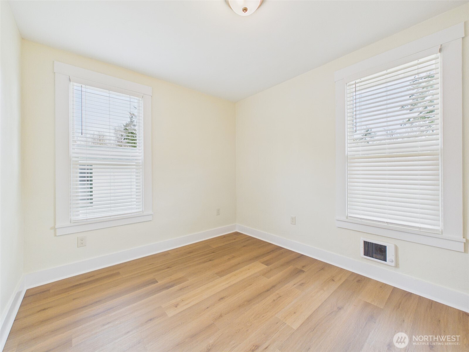 481 Kirkland Road Chehalis, WA 98532 - Photo 19 of 40 a view of an empty room with wooden floor and a window