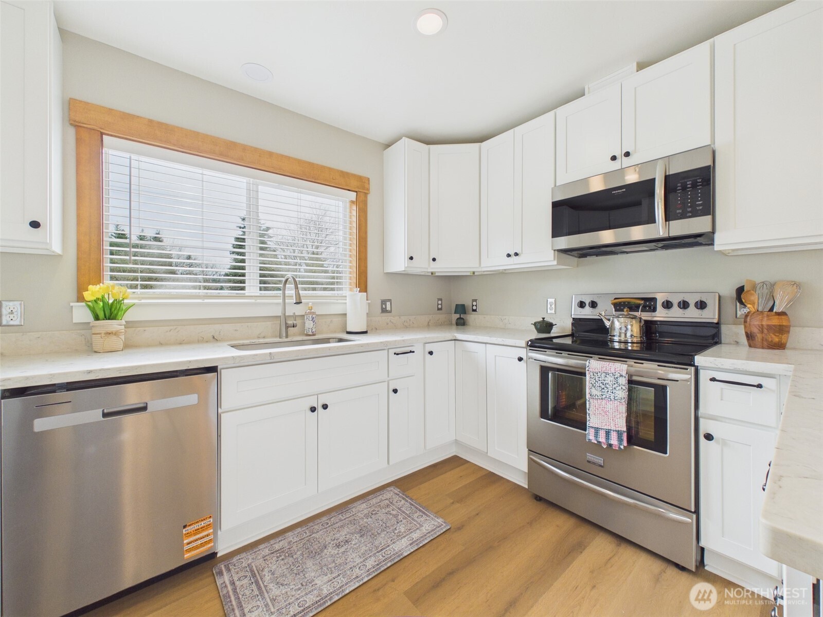 481 Kirkland Road Chehalis, WA 98532 - Photo 9 of 40 a kitchen with stainless steel appliances granite countertop a stove a sink and a microwave