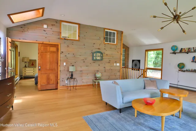 a living room with furniture and a table